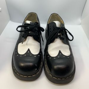 Anarchic black and white wingtip platform shoes
